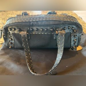 Fendi vintage baguette. Black Cloth body and leather studded handles.
